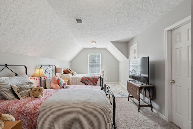 2104 Loudenslager Dr, Thompsons Station, TN 37179 - carpeted bedroom with a textured ceiling and vaulted ceiling