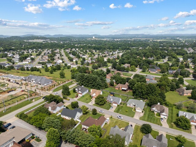 2104 Loudenslager Dr, Thompsons Station, TN 37179 - aerial overview of property's location featuring nearby suburban area and a mountainous background
