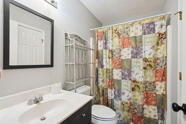 2104 Loudenslager Dr, Thompsons Station, TN 37179 - full bathroom with vanity, a textured ceiling, and curtained shower