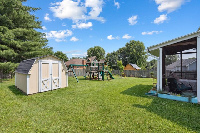 2104 Loudenslager Dr, Thompsons Station, TN 37179 - fenced backyard with a storage shed and a playground