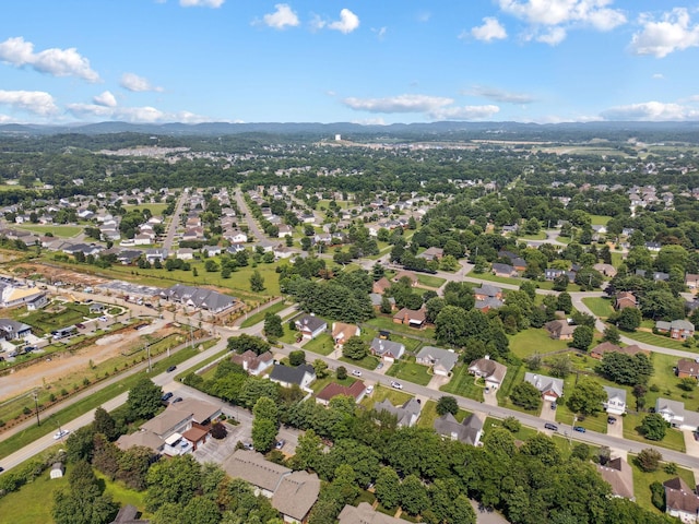 2104 Loudenslager Dr, Thompsons Station, TN 37179 - aerial overview of property's location with a mountain backdrop and nearby suburban area