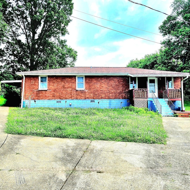 416 Lutie Dr, Nashville, TN 37210 - view of front of home featuring crawl space, a porch, and brick siding