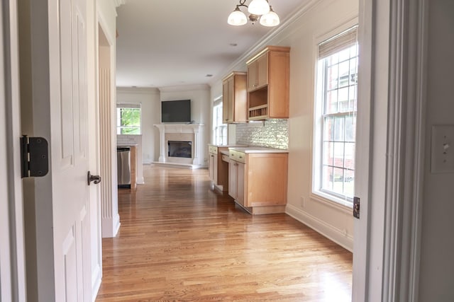 1159 Fairvue Village Ln, Gallatin, TN 37066 - hallway featuring light wood-type flooring, crown molding, a chandelier, and baseboards