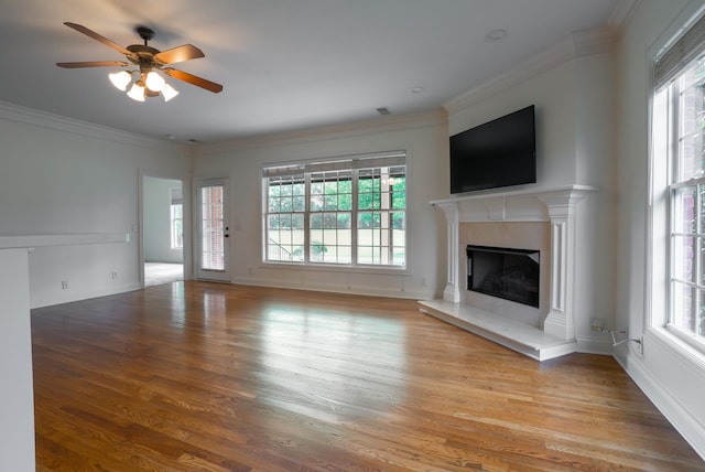 1159 Fairvue Village Ln, Gallatin, TN 37066 - unfurnished living room featuring a high end fireplace, light wood-type flooring, ceiling fan, ornamental molding, and baseboards