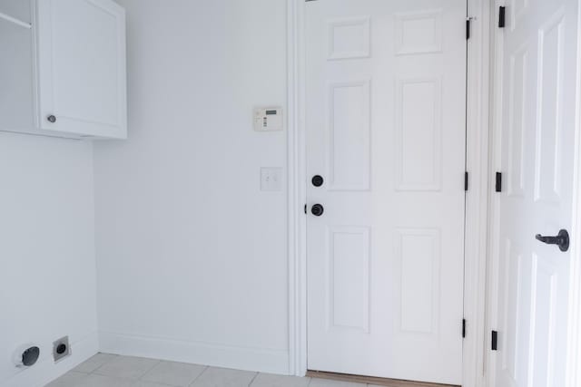 1159 Fairvue Village Ln, Gallatin, TN 37066 - laundry room featuring cabinet space, baseboards, light tile patterned floors, and electric dryer hookup