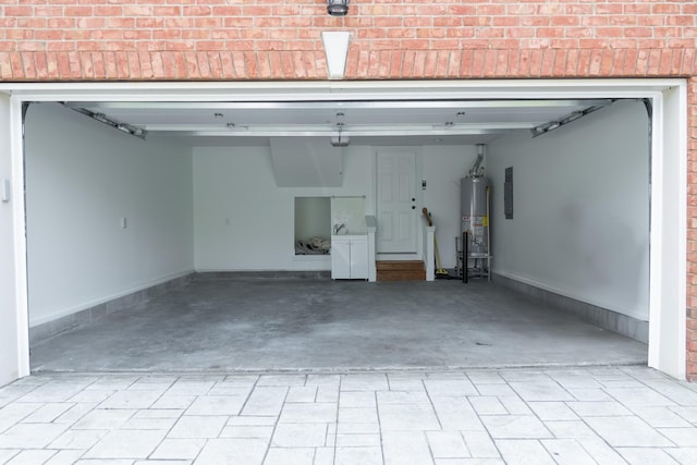 1159 Fairvue Village Ln, Gallatin, TN 37066 - garage featuring decorative driveway, water heater, and electric panel