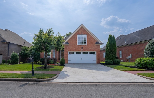 1159 Fairvue Village Ln, Gallatin, TN 37066 - traditional home with brick siding, a garage, a front yard, and driveway