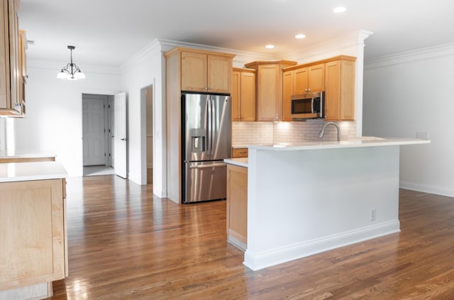1159 Fairvue Village Ln, Gallatin, TN 37066 - kitchen featuring appliances with stainless steel finishes, light brown cabinets, ornamental molding, a peninsula, and light countertops
