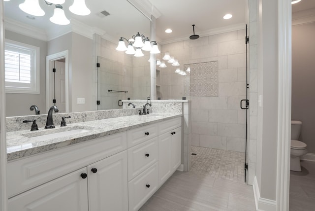 1159 Fairvue Village Ln, Gallatin, TN 37066 - bathroom with double vanity, a stall shower, toilet, a chandelier, and ornamental molding