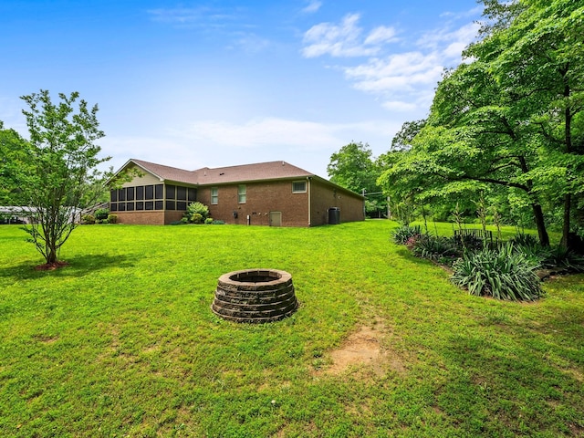 1574 Midway Rd, Sewanee, TN 37375 - view of grassy yard featuring a fire pit and a sunroom