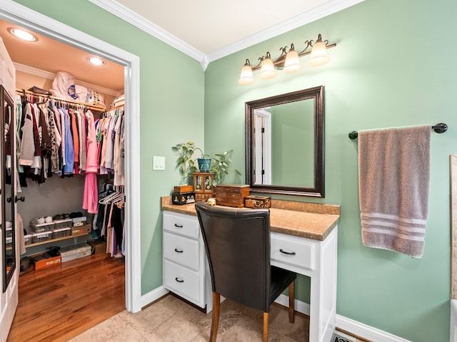 1574 Midway Rd, Sewanee, TN 37375 - bathroom featuring crown molding, vanity, a walk in closet, baseboards, and recessed lighting