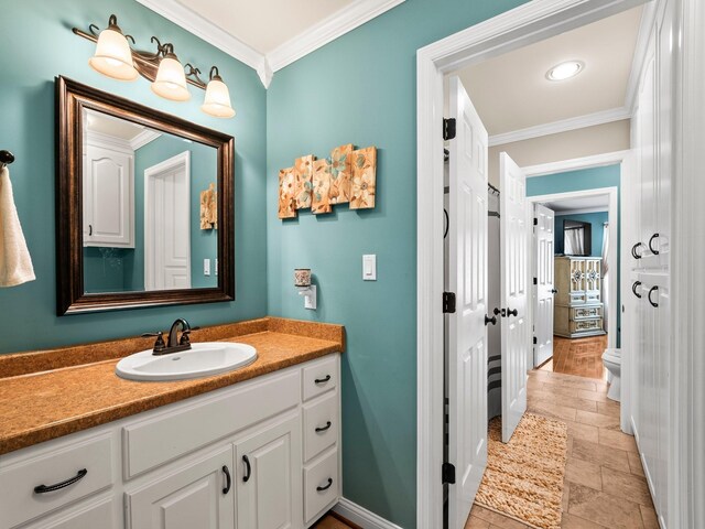 1574 Midway Rd, Sewanee, TN 37375 - bathroom with ornamental molding, vanity, baseboards, toilet, and stone tile flooring