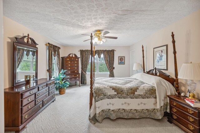 6873 Giles Hill Rd, College Grove, TN 37046 - bedroom with light colored carpet, multiple windows, a textured ceiling, and a ceiling fan