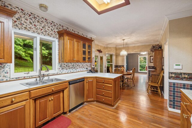 6873 Giles Hill Rd, College Grove, TN 37046 - kitchen featuring a sink, stainless steel dishwasher, a peninsula, light wood-type flooring, and light countertops