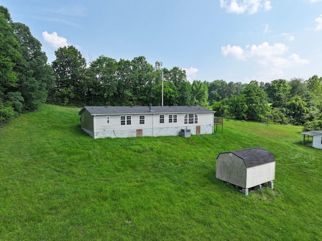 947 Buck Branch Rd, Charlotte, TN 37036 - rear view of house with a yard, a view of trees, and crawl space