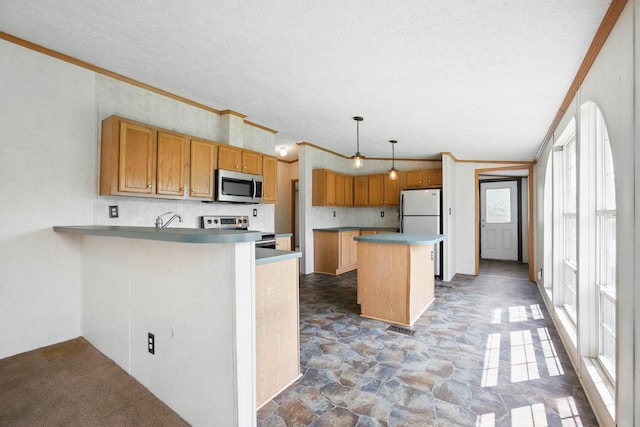 947 Buck Branch Rd, Charlotte, TN 37036 - kitchen with appliances with stainless steel finishes, crown molding, tasteful backsplash, a kitchen island, and a textured ceiling