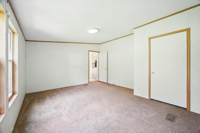947 Buck Branch Rd, Charlotte, TN 37036 - unfurnished bedroom featuring carpet, crown molding, and a textured ceiling
