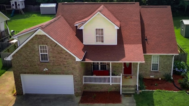 674 Superior Ln, Clarksville, TN 37043 - view of front of home featuring brick siding, covered porch, an attached garage, and driveway