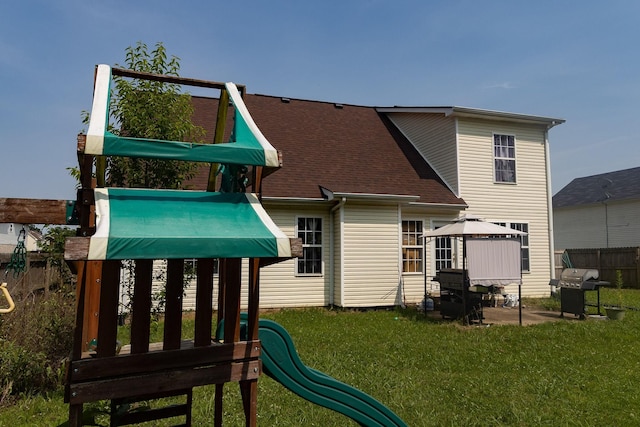 674 Superior Ln, Clarksville, TN 37043 - back of property featuring a patio area, a playground, and roof with shingles