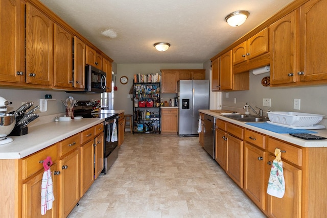 674 Superior Ln, Clarksville, TN 37043 - kitchen with appliances with stainless steel finishes, brown cabinetry, and light countertops