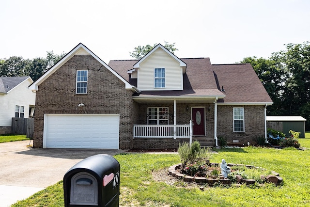 674 Superior Ln, Clarksville, TN 37043 - traditional home with a porch, asphalt driveway, a garage, brick siding, and a front yard