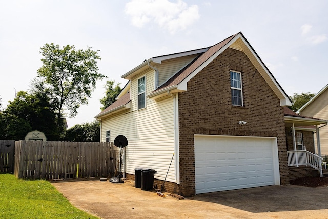 674 Superior Ln, Clarksville, TN 37043 - view of property exterior featuring concrete driveway, a garage, and brick siding