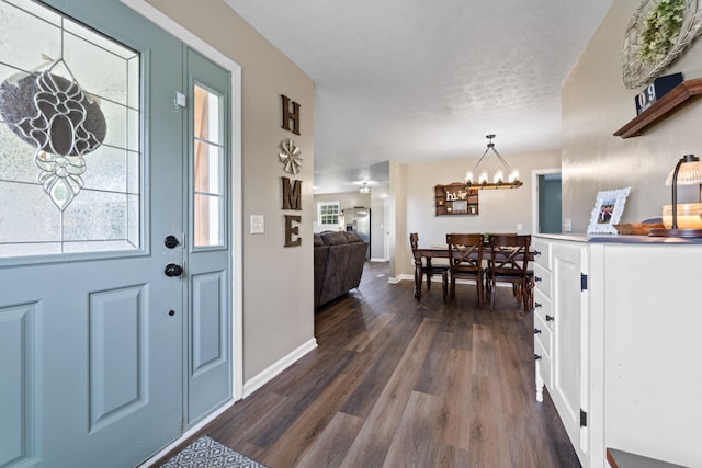 2237 Cold Springs Rd, Lafayette, TN 37083 - foyer with dark wood finished floors, a chandelier, and baseboards