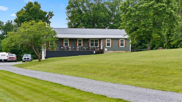 2237 Cold Springs Rd, Lafayette, TN 37083 - view of front of property featuring covered porch, a front lawn, and metal roof