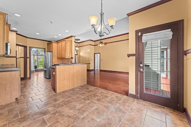 3696 Prestwicke Pl, Adams, TN 37010 - kitchen with freestanding refrigerator, ornamental molding, a chandelier, white microwave, and open floor plan