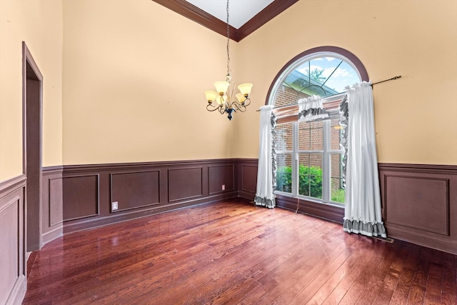 3696 Prestwicke Pl, Adams, TN 37010 - spare room featuring ornamental molding, a chandelier, plenty of natural light, dark wood-type flooring, and wainscoting