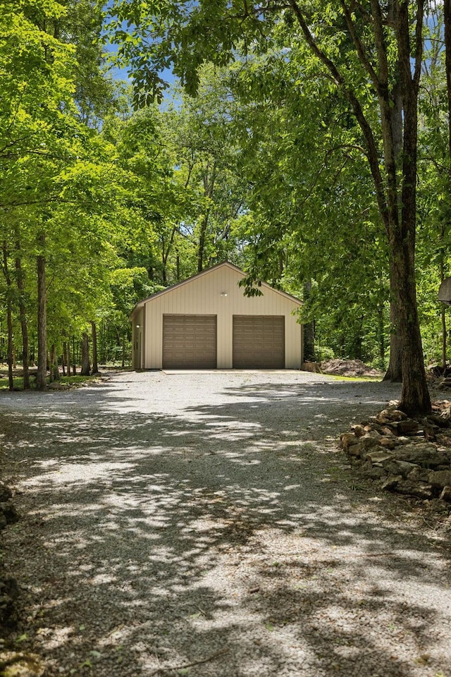 1150 Deer Run Rd, Murfreesboro, TN 37128 - view of side of property featuring a detached garage and an outbuilding