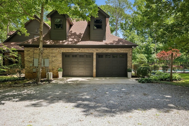1150 Deer Run Rd, Murfreesboro, TN 37128 - view of front of house featuring a garage, driveway, brick siding, and a shingled roof