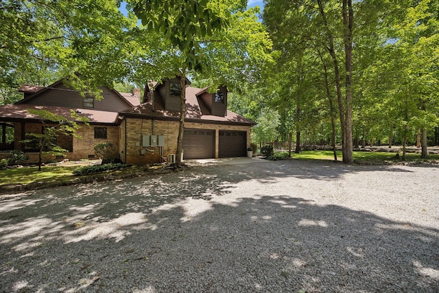 1150 Deer Run Rd, Murfreesboro, TN 37128 - view of front of home featuring a garage, driveway, and brick siding