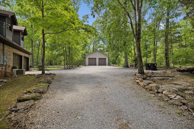 1150 Deer Run Rd, Murfreesboro, TN 37128 - view of yard featuring central air condition unit, a detached garage, and an outbuilding