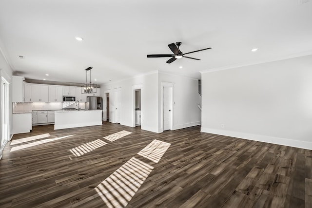556 Kingwood Ln, White House, TN 37188 - unfurnished living room with recessed lighting, ornamental molding, ceiling fan, a sink, and dark wood-style floors