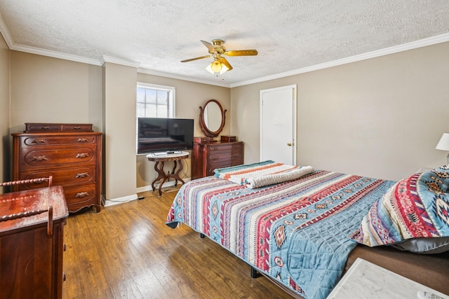 8663 Dog Creek Rd, Primm Springs, TN 38476 - bedroom featuring hardwood / wood-style flooring, a textured ceiling, crown molding, a ceiling fan, and baseboards