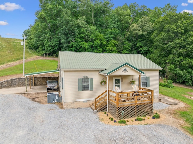 8663 Dog Creek Rd, Primm Springs, TN 38476 - bungalow-style home with driveway, metal roof, crawl space, a wooden deck, and an attached carport