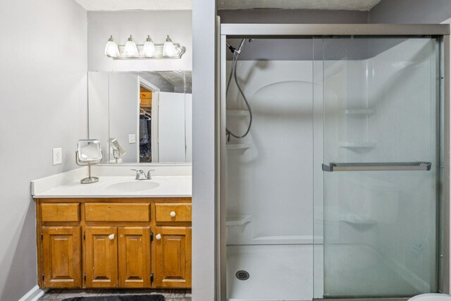8663 Dog Creek Rd, Primm Springs, TN 38476 - bathroom featuring a stall shower, vanity, and toilet
