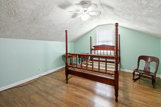 8663 Dog Creek Rd, Primm Springs, TN 38476 - bedroom featuring baseboards, a textured ceiling, lofted ceiling, wood finished floors, and ceiling fan