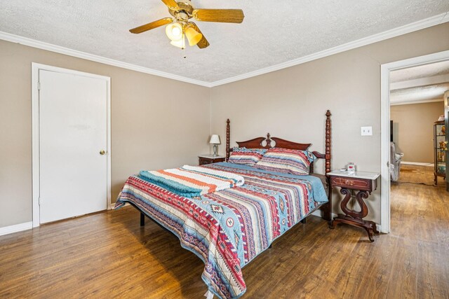 8663 Dog Creek Rd, Primm Springs, TN 38476 - bedroom with wood finished floors, a textured ceiling, ornamental molding, ceiling fan, and baseboards
