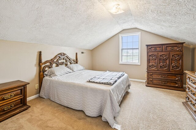 8663 Dog Creek Rd, Primm Springs, TN 38476 - carpeted bedroom with a textured ceiling, lofted ceiling, and baseboards