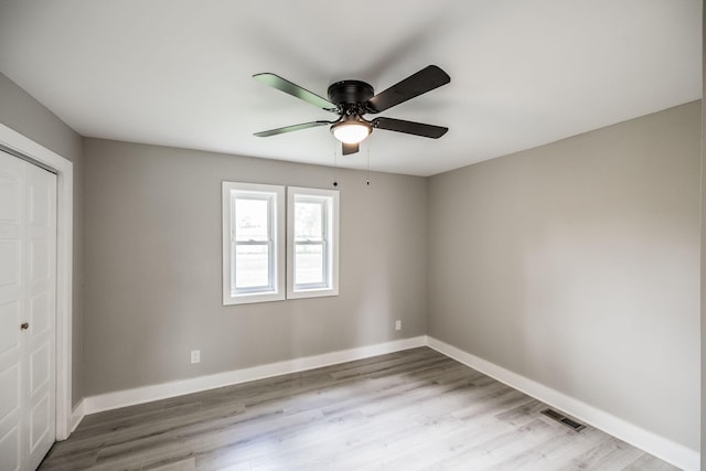 1108 Pruitt Ln, Gallatin, TN 37066 - unfurnished bedroom featuring a closet, wood finished floors, and a ceiling fan