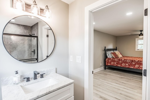1108 Pruitt Ln, Gallatin, TN 37066 - full bathroom featuring vanity, wood finished floors, a stall shower, and a ceiling fan