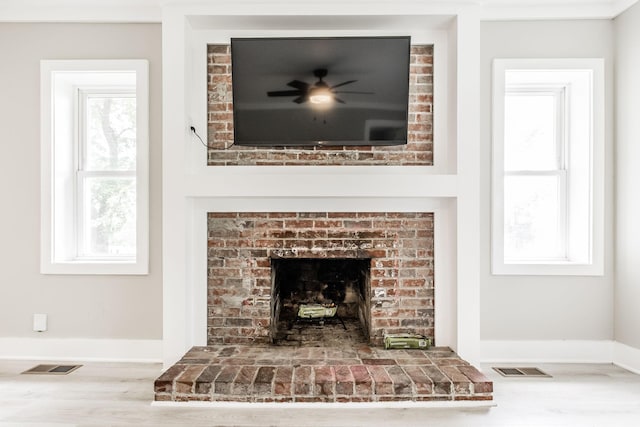 1108 Pruitt Ln, Gallatin, TN 37066 - detailed view of wood finished floors, a brick fireplace, and baseboards
