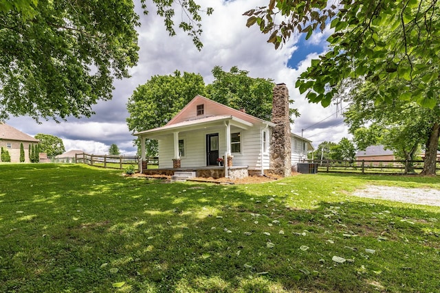 1108 Pruitt Ln, Gallatin, TN 37066 - view of front of property featuring covered porch, a chimney, and central air condition unit