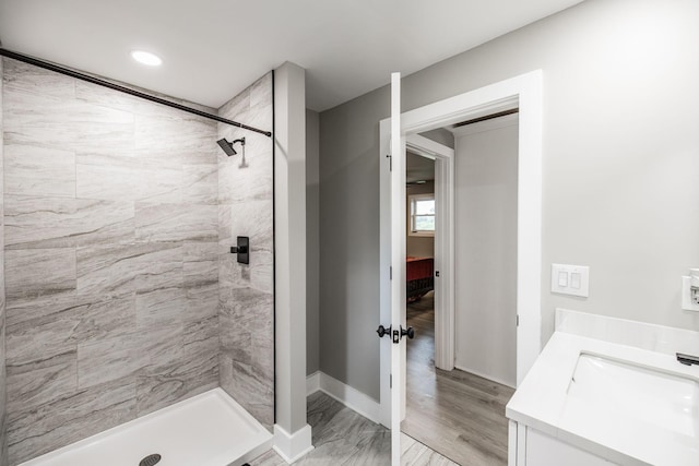 1108 Pruitt Ln, Gallatin, TN 37066 - bathroom featuring tiled shower, vanity, and baseboards