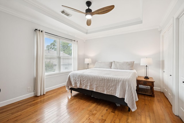 3453 Parkwood Ct, Hermitage, TN 37076 - bedroom featuring light wood-type flooring, a tray ceiling, baseboards, ornamental molding, and ceiling fan