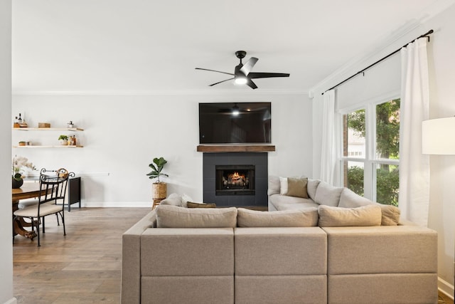 3453 Parkwood Ct, Hermitage, TN 37076 - living room with crown molding, wood finished floors, a ceiling fan, a fireplace, and baseboards