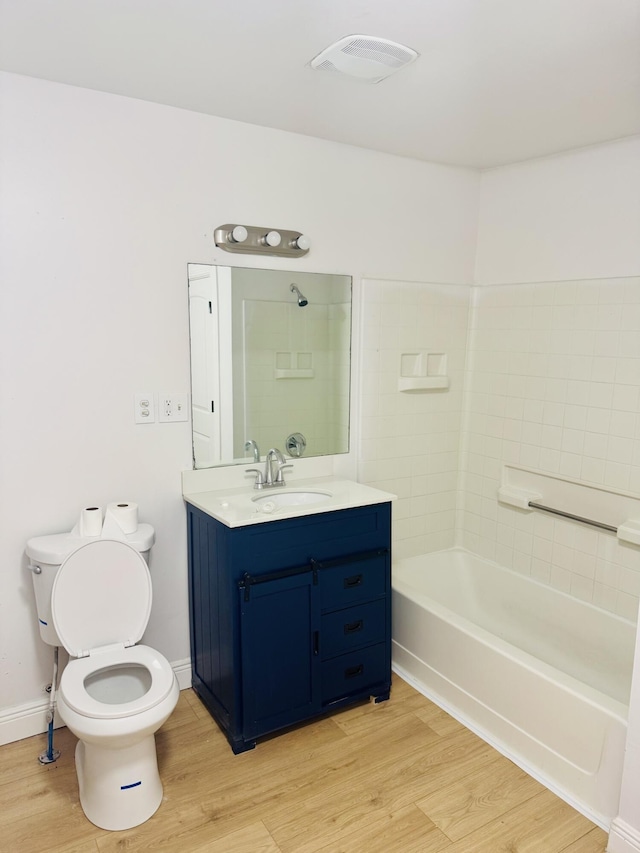 1714 Stanfiel St, Chattanooga, TN 37406 - full bathroom featuring toilet, vanity, wood finished floors, and tub / shower combination