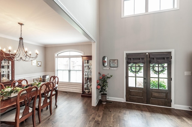 1184 Wicke Rd, Adams, TN 37010 - foyer entrance with a chandelier, french doors, dark wood-type flooring, ornamental molding, and a towering ceiling
